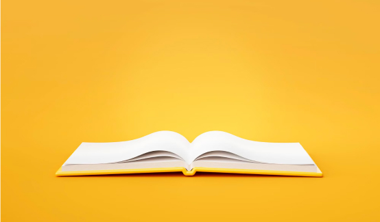 An image of an open book with a yellow background