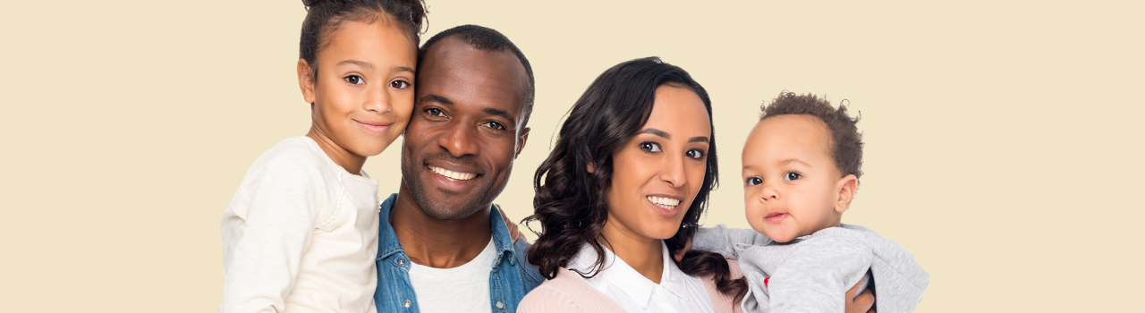 The image shows a family of four members, with both parents holding their babies.